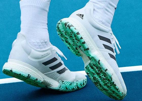 Adidas Resolution white tennis shoes 